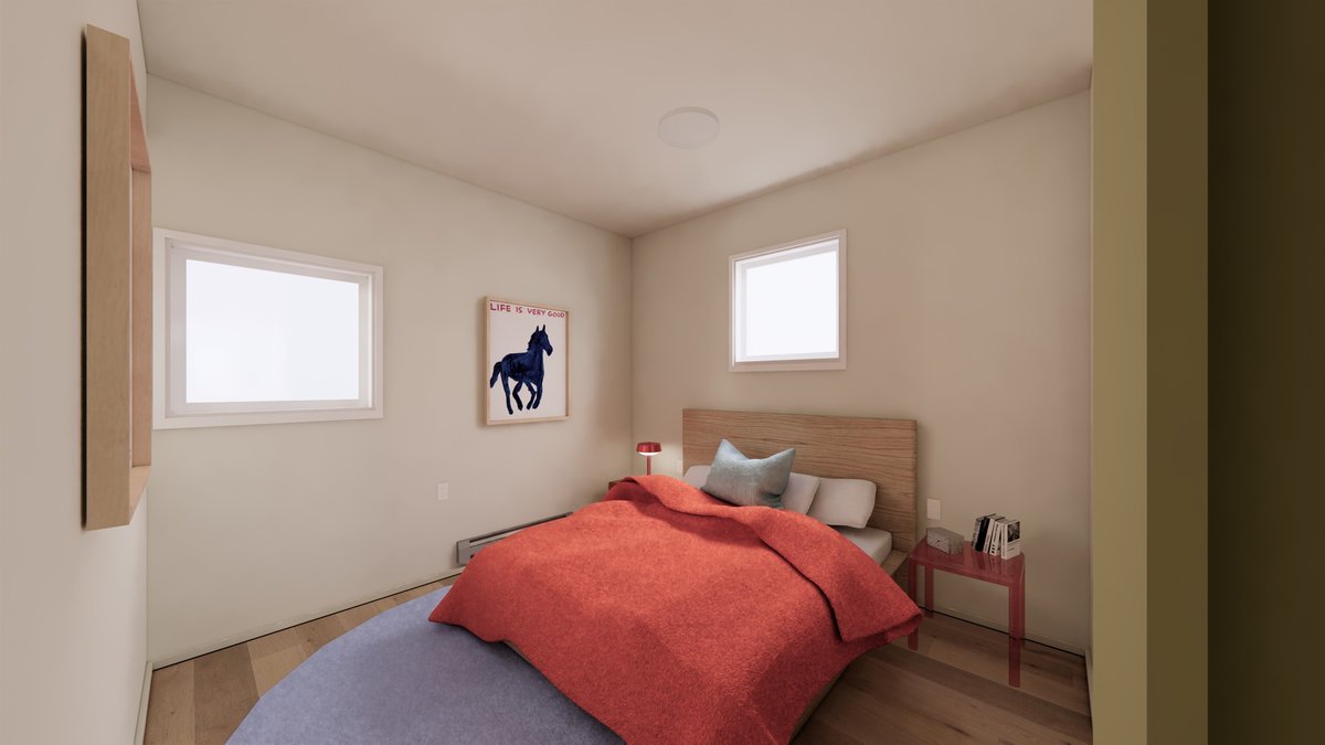 Two-bedroom interior with warm light and a window to the sky.