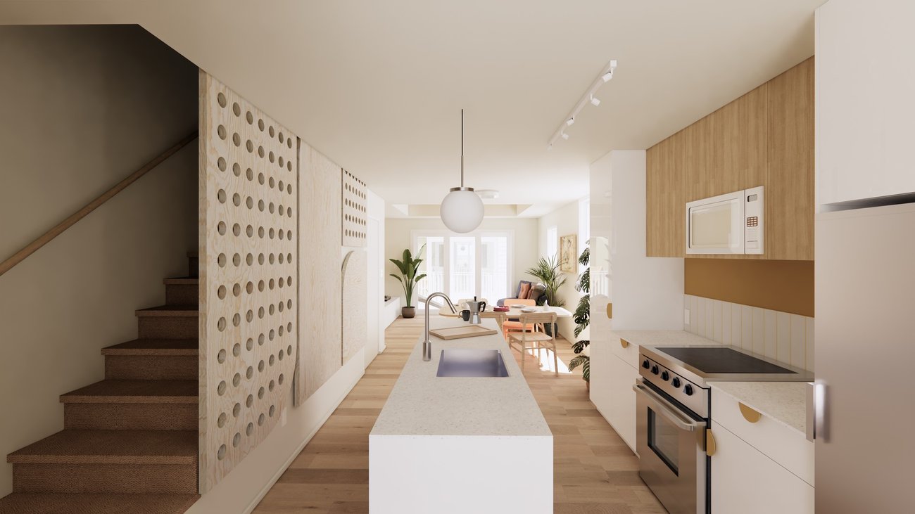 Goodweather kitchen with warm wood cabinets, white island, and a planted window.